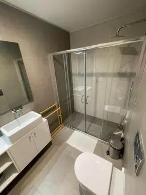 a bathroom with a shower and a toilet and a sink at CC Downtown Palace - F in Porto
