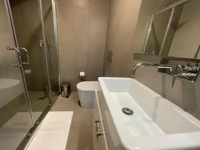 a bathroom with a sink and a shower and a toilet at CC Downtown Palace - J in Porto