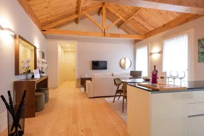 a kitchen and living room with a couch and a table at CC Downtown Palace - J in Porto