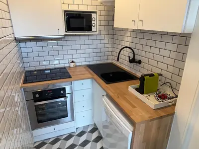 a small kitchen with a sink and a stove at SantOporto Clérigos in Porto