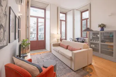 a living room with a couch and two chairs at Bolhão - Dixo's Oporto Apartments VIII in Porto