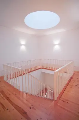 a white staircase in a room with a ceiling at Bolhão - Dixo's Oporto Apartments VIII in Porto