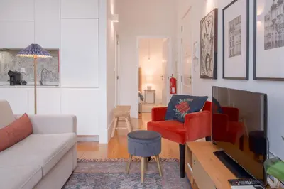 a living room with a couch and a tv at Bolhão - Dixo's Oporto Apartments VIII in Porto