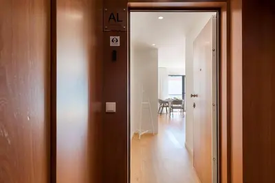 an open door to a room with a hallway at LovelyStay - Heart of D. Pedro Apartments IV in Porto