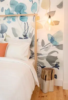 a bedroom with a bed and a wall covered in blue butterflies at São Vítor Douro Living in Porto