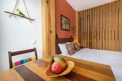 a bedroom with a bed with a bowl of fruit on a table at São Vítor Douro Living in Porto