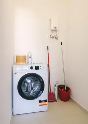 a washer and dryer in a room at D&S - Family Apartments I in Porto