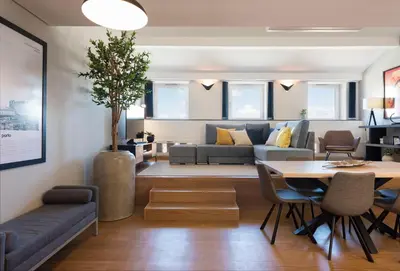 a living room with a couch and a table at Modern Loft with AC in Downtown Porto by LovelyStay in Porto