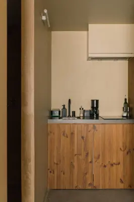 a kitchen with wooden cabinets and a sink at JAM Porto in Porto