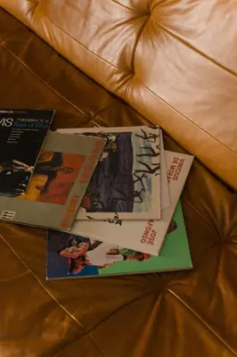 three magazines sitting on top of a couch at JAM Porto in Porto