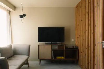 a living room with a tv and a couch at JAM Porto in Porto