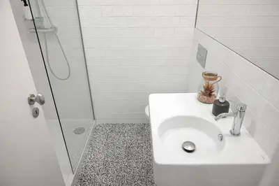 a bathroom with a toilet and a shower and a sink at Oporto Classic Terrace in Porto