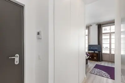 an open door to a room with a living room at GuestReady - The Art of Music in Porto