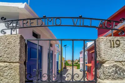 a sign that reads marina village on a building at Maredimo Village Casa 3 in Porto