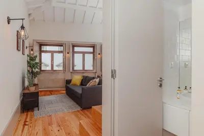 a living room with a couch and a sink at Oporto Artist´s Loft in Porto