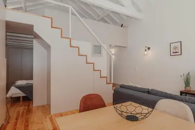 a living room with a couch and a table at Oporto Artist´s Loft in Porto