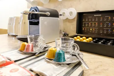 a counter with two cups and a coffee maker at The Bitcoin Chapel Iconic Luxury Residence in Porto