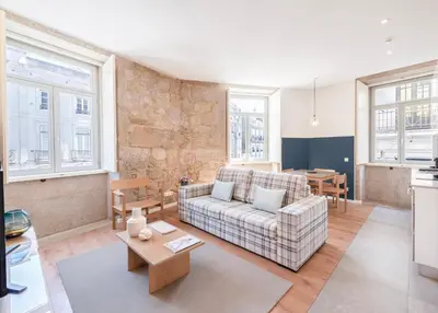 a living room with a couch and a table at Mouzinho da Silveira Unique Apartments, by Oporto Collection in Porto