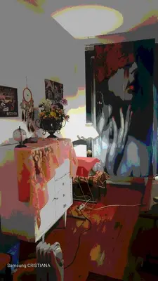 a room with a painting of a woman on a dresser at AL- Almada 4 in Porto