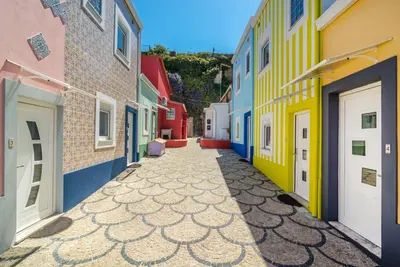 an alley with colorful buildings in a city at Maredimo Village Casa 6 in Porto