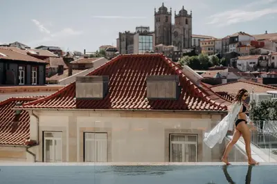 a row of exercise bikes in a gym at Casa da Companhia Hotel & Spa, Vignette Collection by IHG in Porto