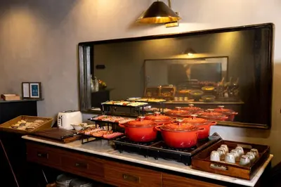a buffet of food with different types of food at Fontinha Porto, Trademark Collection by Wyndham in Porto