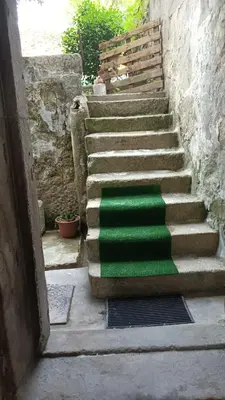 a hallway with a room with a table and a door at AL-Pinheiro 62 in Porto