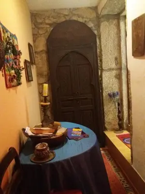 a room with a yellow wall with a mirror at Al Pinheiro 66 in Porto