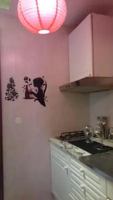 a bathroom with a black toilet and the eiffel tower at Al Pinheiro 66 in Porto