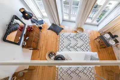 an overhead view of a living room with a white couch at GuestReady - Cosy living in downtown in Porto