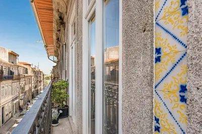 a window on a building with a view of a street at GuestReady - Cosy living in downtown in Porto