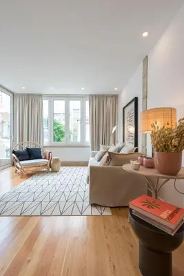 a living room with a couch and a table at GuestReady - The Dukes Retreat E in Porto