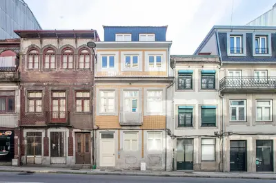 a row of old buildings on a city street at LovelyStay - Cozy 1BR in Santa Catarina w/ Balcony in Porto