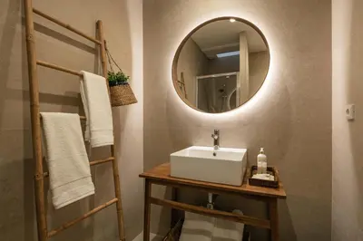 a bathroom with a sink and a mirror at Oportments - S.Bento in Porto