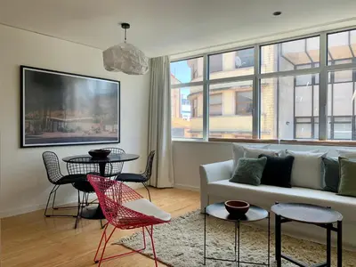 a living room with a couch and a table at Oporto Chic & Cozy - Santa Catarina in Porto