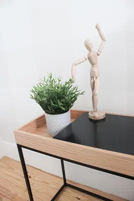 a mannequin standing on a table with a plant at Oporto Garden's Home in Porto