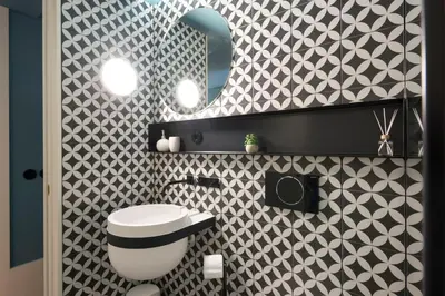 a bathroom with a white toilet and a mirror at Ribeira Old Town Charming Flat w/ AC by LovelyStay in Porto
