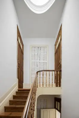 a spiral staircase in a white room with a round ceiling at Uba - Heritage and Wine in Porto