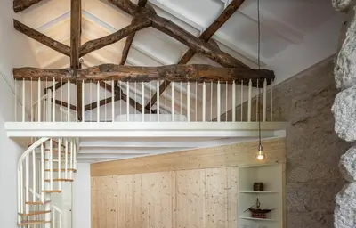 a room with wooden walls and a ceiling with beams at Uba - Heritage and Wine in Porto