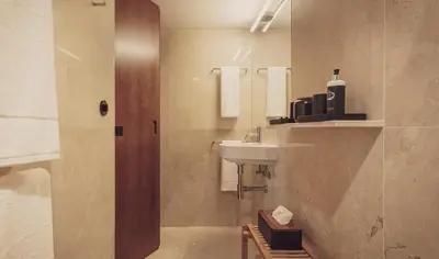 a bathroom with a sink and a mirror at Ceuta Terrace Suites in Porto