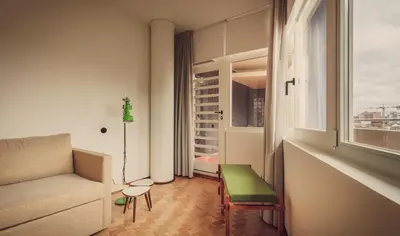 a living room with a couch and a window at Ceuta Terrace Suites in Porto