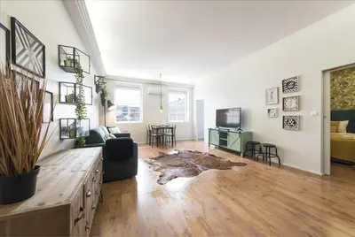 a large living room with a couch and a tv at Sta Catarina - 2 Bedroom Apartament in Porto