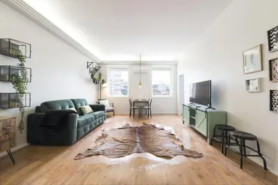 a living room with a couch and a table at Sta Catarina - 2 Bedroom Apartament in Porto