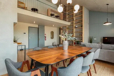 a living room with a flat screen tv on a wall at Feel Porto Corporate Housing Campanhã in Porto