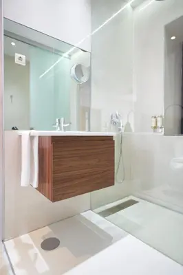 a bathroom with a sink and a shower at Rio da Vila in Porto