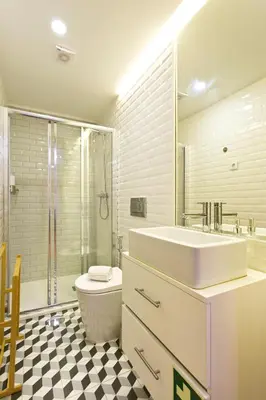 a bathroom with a sink and a toilet and a shower at Miragaia Rio in Porto