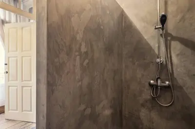 a shower in a bathroom with a wall at VIVA Fabulous Old World in Porto