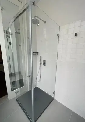 a shower with a glass door in a bathroom at GuestReady - Bourse Apartments in Porto