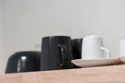 a close up of a table with a cup and a mug at GuestReady - Bourse Apartments in Porto