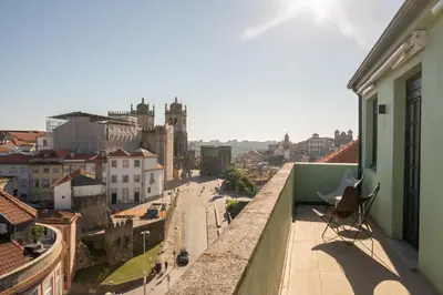 a balcony with a view of a city at The Cathedral's Terrace in Porto